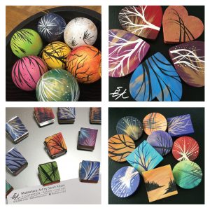 Samples of painted crafts: ball ornaments, wooden hearts, wood magnet clips and pins